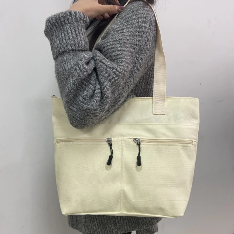 

Spring New Product Student Canvas Shoulder Bag Unique Zipper Design Advanced Handbag Fashion Large Capacity Commuting Tote Bag