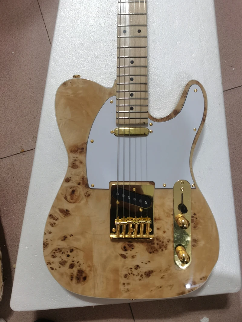 

Original wood color TL electric guitar, maple head, maple fingerboard, body front spalted maple, gold electronic hardwan stock