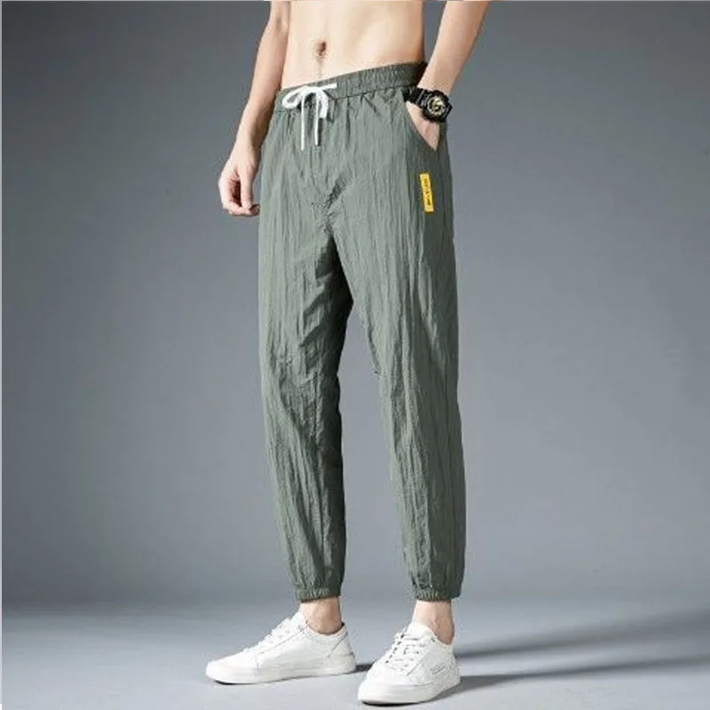 Men Solid Color Elastic Waist Summer Men Breathable Motion Casual Korean Ice Shreds Trend Thin Style Loose Large Size Pants