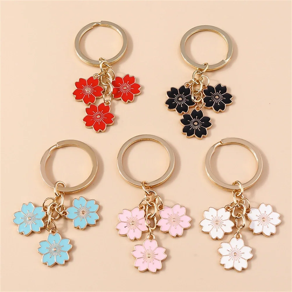 PLCPDM Portachiavi con ciondolo a forma di fiore di ciliegie, alla moda, leggero, da borsa, da donna, decorazione per borsa, Peluche
