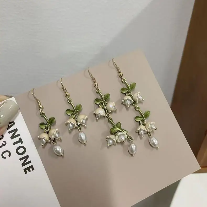 S56ca2fece91544bc94d50e12d163de5cY Elegant White Orchid Flower Earring for Women Ladies Temperament Metal Leaves Long Tassel Drop Earrings Hook Jewelry Accessories Mallzona