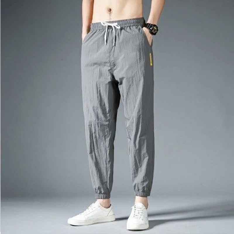 

Men Solid Color Elastic Waist Summer Men Breathable Motion Casual Korean Ice Shreds Trend Thin Style Loose Large Size Pants
