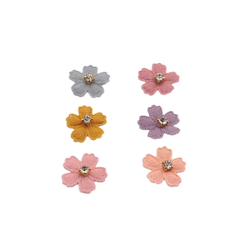 A set of 20 small fabric flower patches, perfect for use in projects, hair accessories, headbands, bows, and hat dec