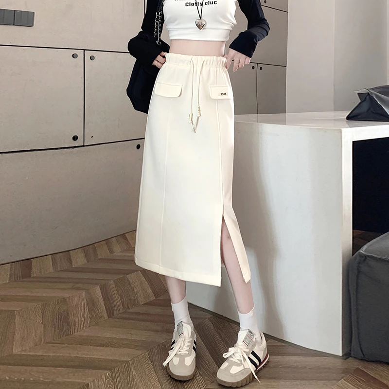 

Mid length elastic thickened skirt for women in autumn and winter 2023, high waisted casual one step skirt, split sports long
