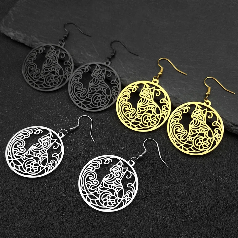 A collection of hollow circular cat and flower of life filigree pendant earrings in polished silver, gold, and gunmetal black showing explicit size parameters