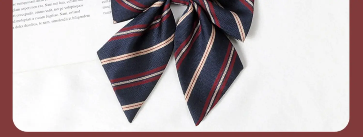 Multiple striped bow ties displayed on white and book background