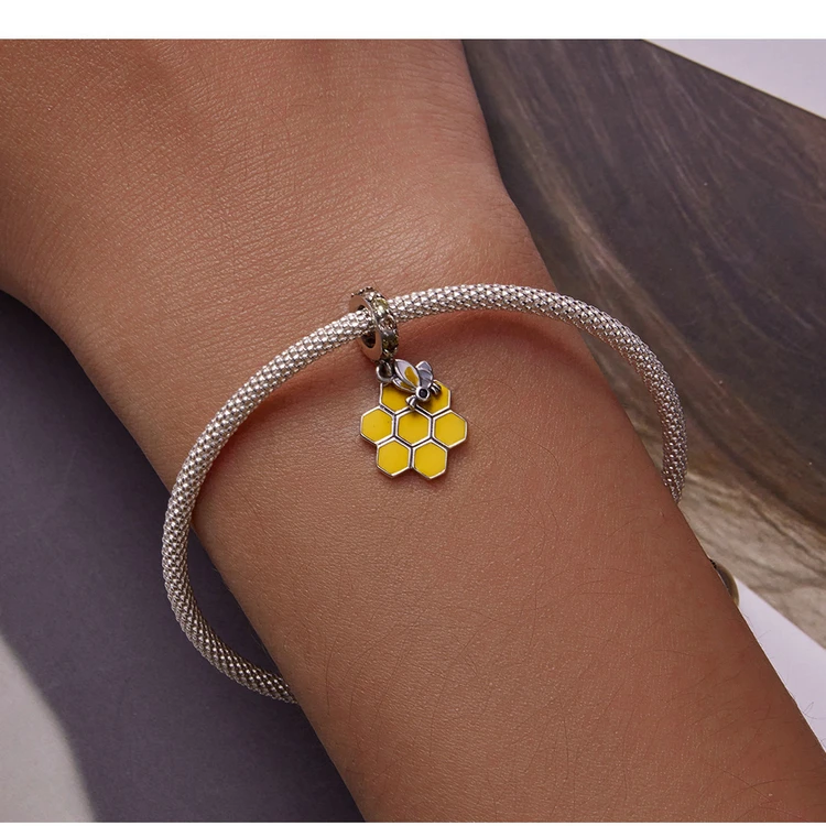 Honeycomb & Bee Dangle Charm for Pandora Bracelet | S925 Sterling Silver | Go Glam Girl 15 Honeycomb & Bee Dangle Charm for Pandora Bracelet | S925 Sterling Silver | Go Glam Girl - Show your style with the Honeycomb & Bee Dangle Charm. Hand-finished in sterling silver, this design includes a honeycomb with a padlock of small and cute bee dangling on it. The dangle is decorated with sparkling yellow and light green cubic zirconia stones. Wear in spring and summer to bring mood and beauty to your day. Perfect gift for mom, sister, grandmother, friend or yourself. | 🚚 Free Standard Shipping 7-30 days | 🥇 Top Quality Product | 💎 100% S925 Sterling Silver | 🛡️ 100% Safe & Secure checkout