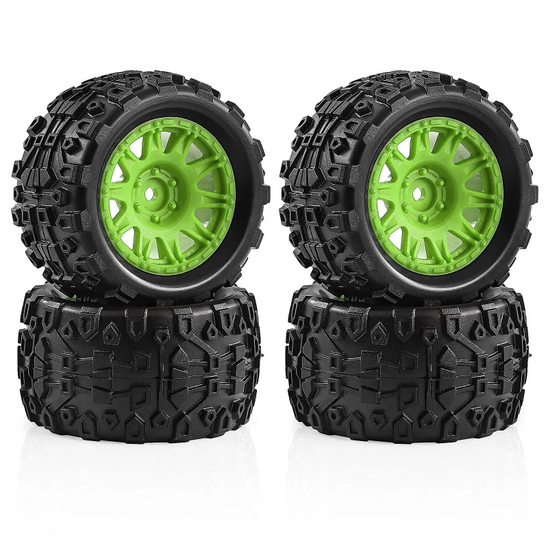 Quatre pneus larges 1/18 pour ARRMA TYPHON GROM GRANITE empilés, montrant l'épaisseur du caoutchouc.