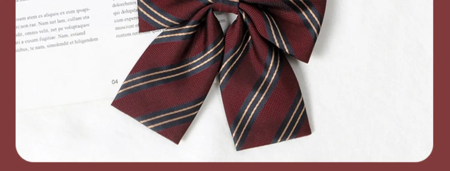 Multiple striped bow ties displayed on white and book background
