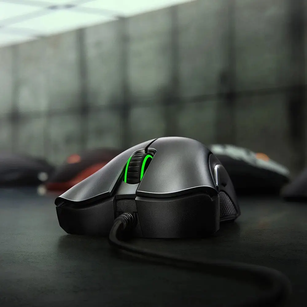 Sleek Black Wired Gaming Mouse with 6400 DPI Optical Sensor and 5 Customizable Buttons