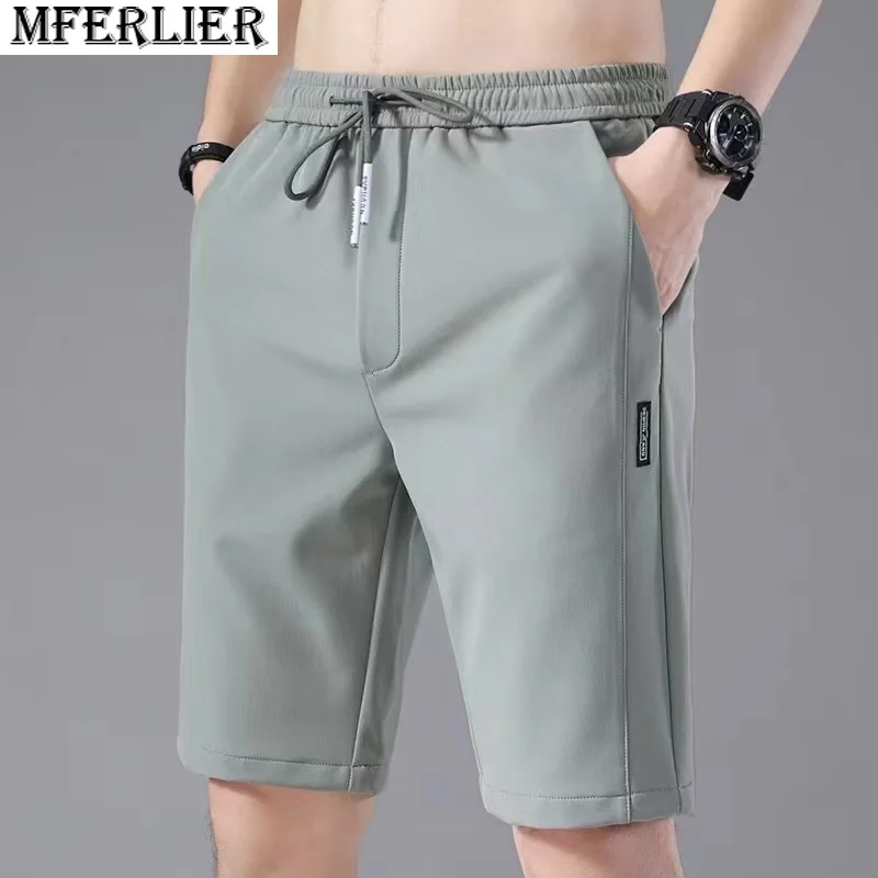 

summer men sports ice shorts quick dry beach shorts 5XL green thin elastic loose simple work out gym shorts