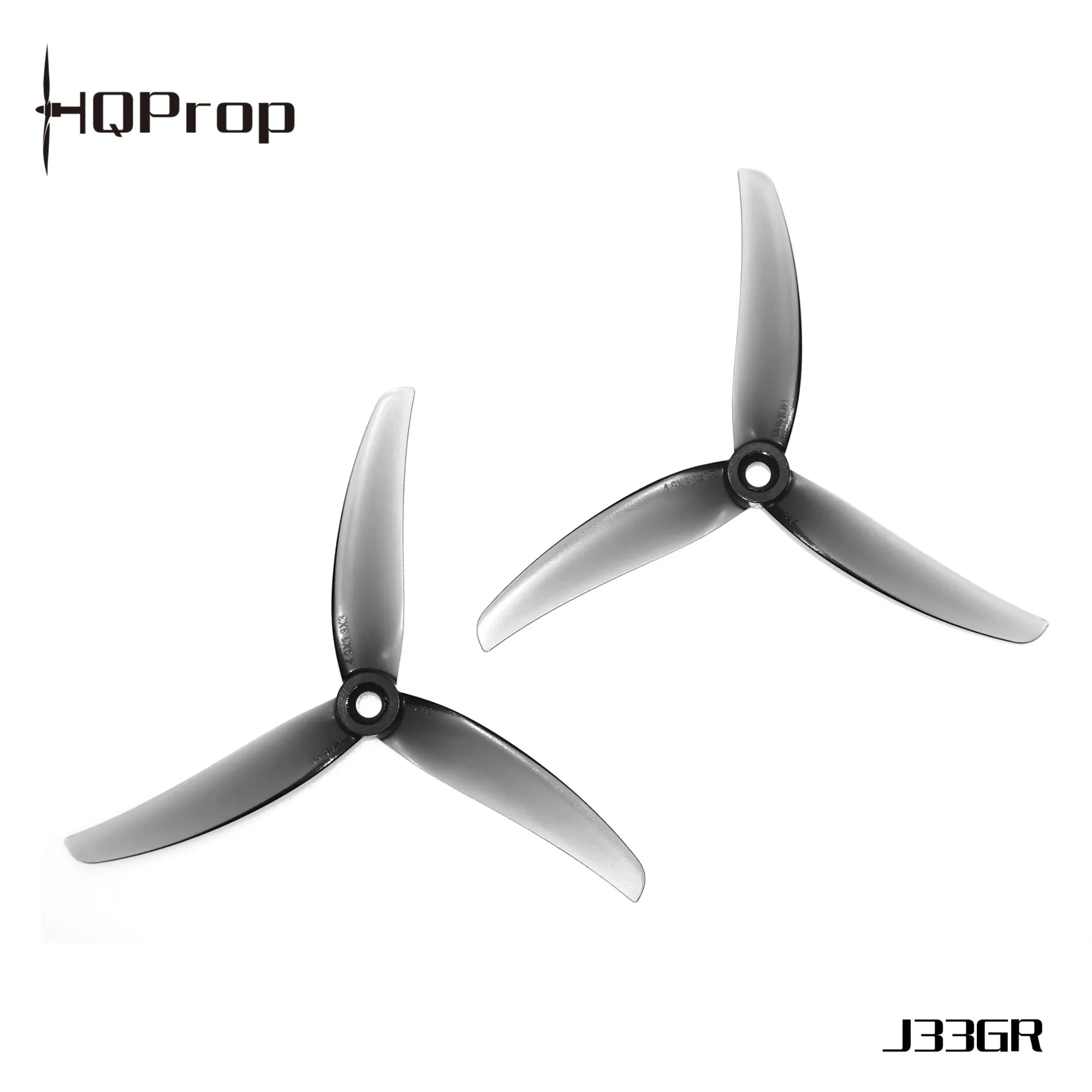 Détail des hélices drone 4,9 pouces 3 pales, avec reflets lumineux sur le polycarbonate.