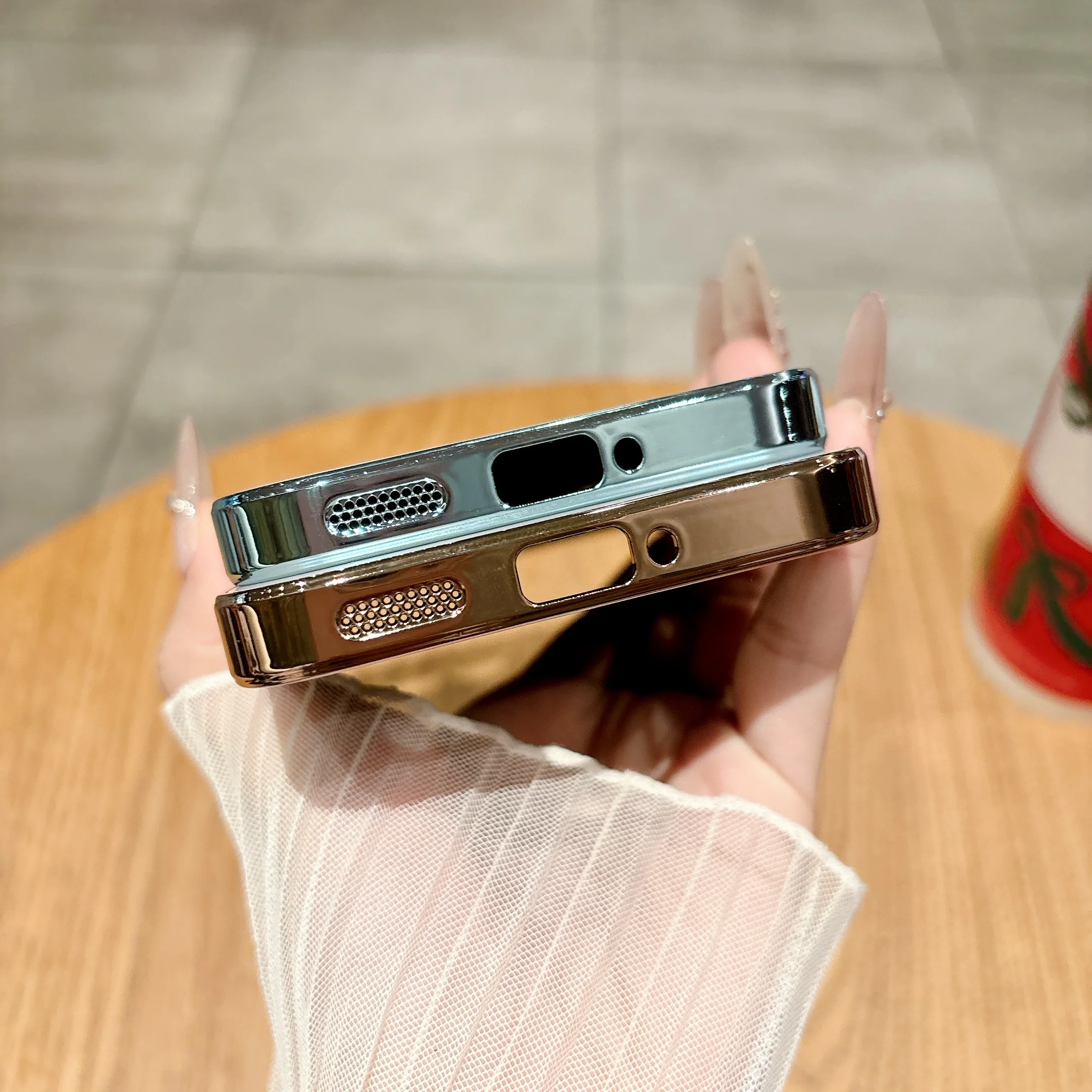 Shockproof case with electroplated TPU soft edges and anti-scratch lens film.