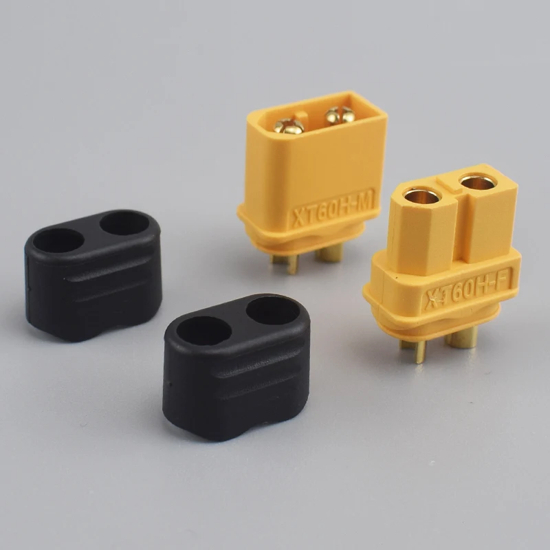 Connecteur XT60H mâle avec broches dorées et gaine de protection pour batterie LiPo RC.
