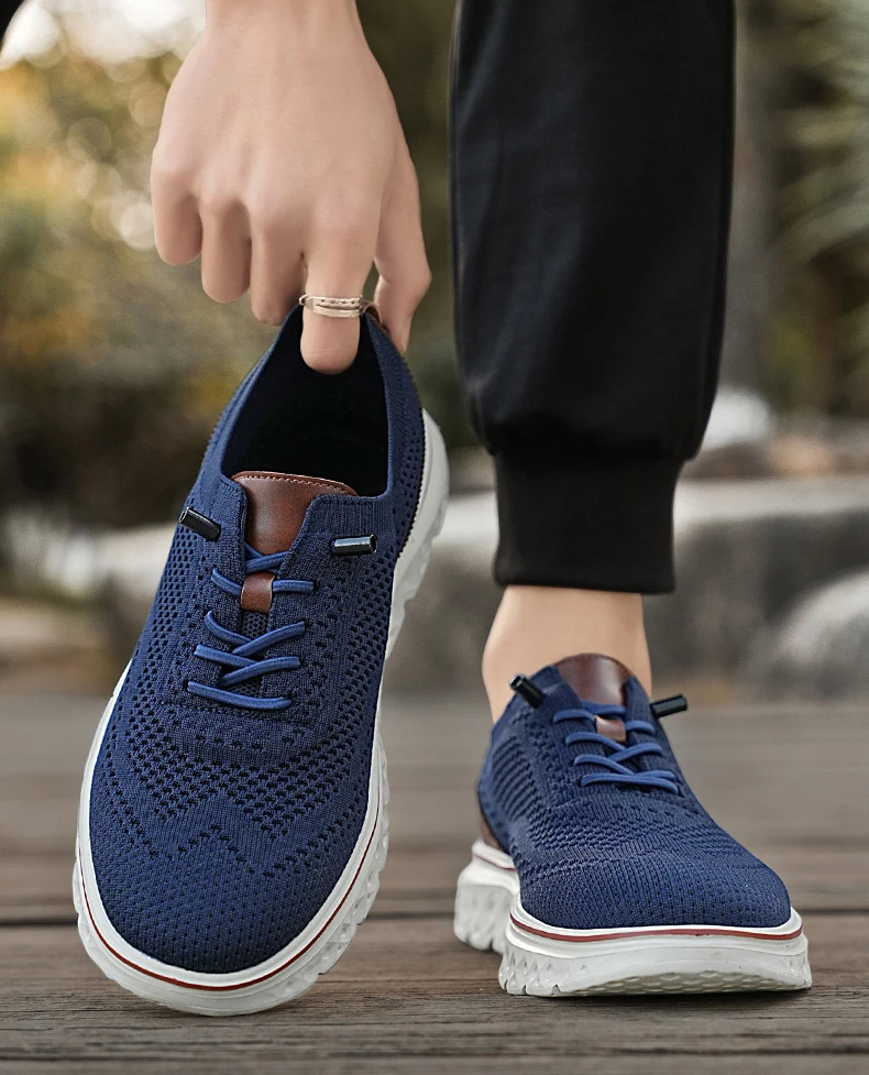 Pair of brown mesh sneakers with soft soles placed on a concrete surface, highlighting breathable texture and sporty silhouette blue 02