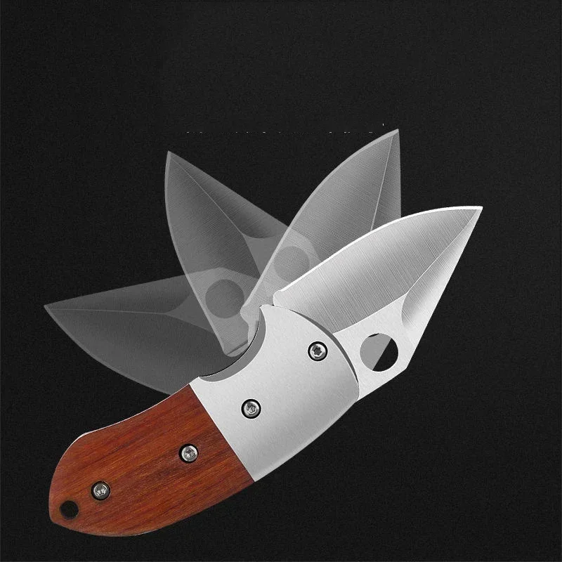 Mini foldable knife being used to slice fruit