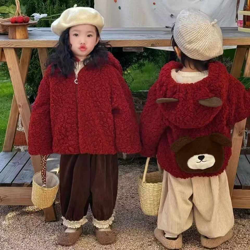 Child wearing jacket in winter setting