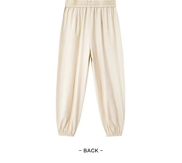 Pantalones casuales para mujer diseñados con un toque de textura. Pantalones cónicos de jacquard con estampado oscuro y un ajuste único y holgado.