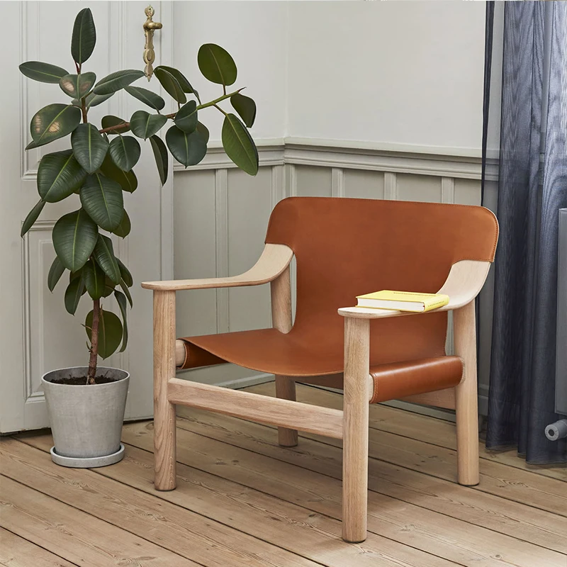

Nordic single person sofa chair saddle leather dining chair home leisure chair designer retro solid wood armrest armchair.
