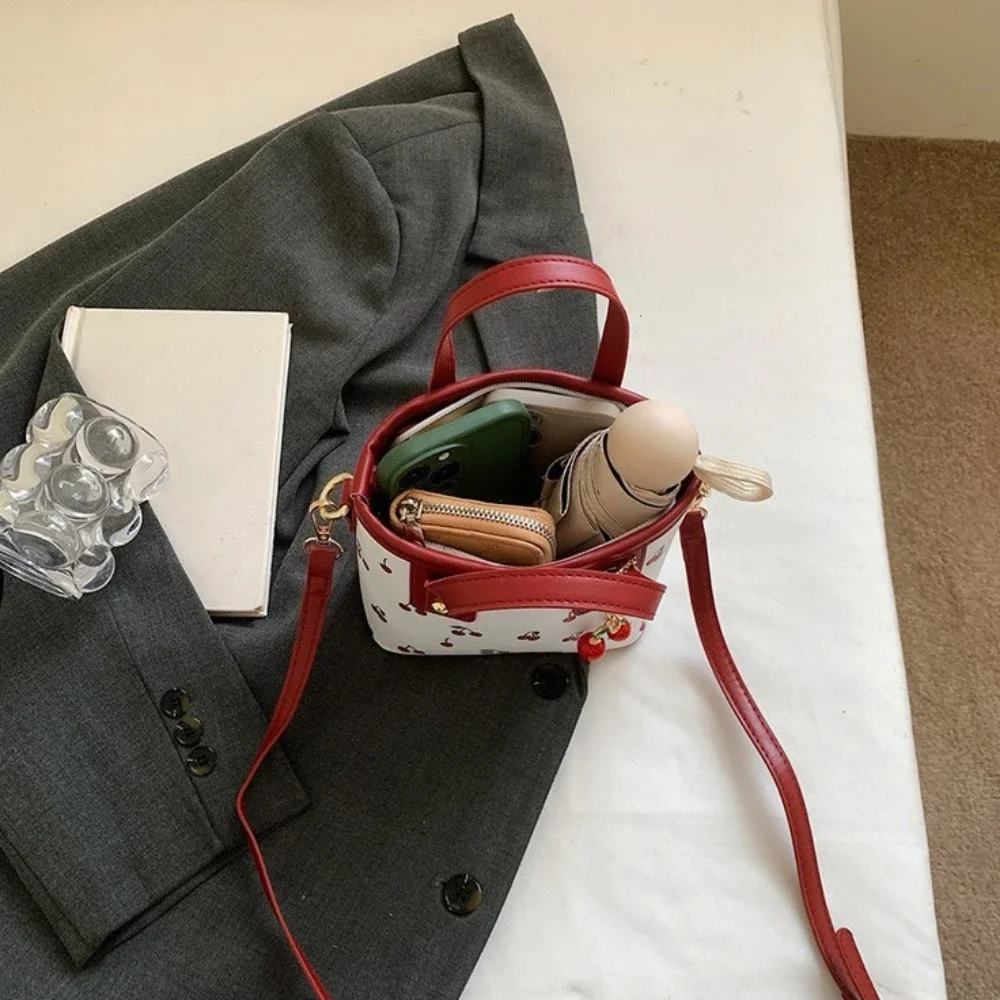 Women PU Cherry Shoulder Bag Large Capacity Trendy Commuting Bag with Cherry Pendant Stylish Crossbody Bag Aesthetic Handbag