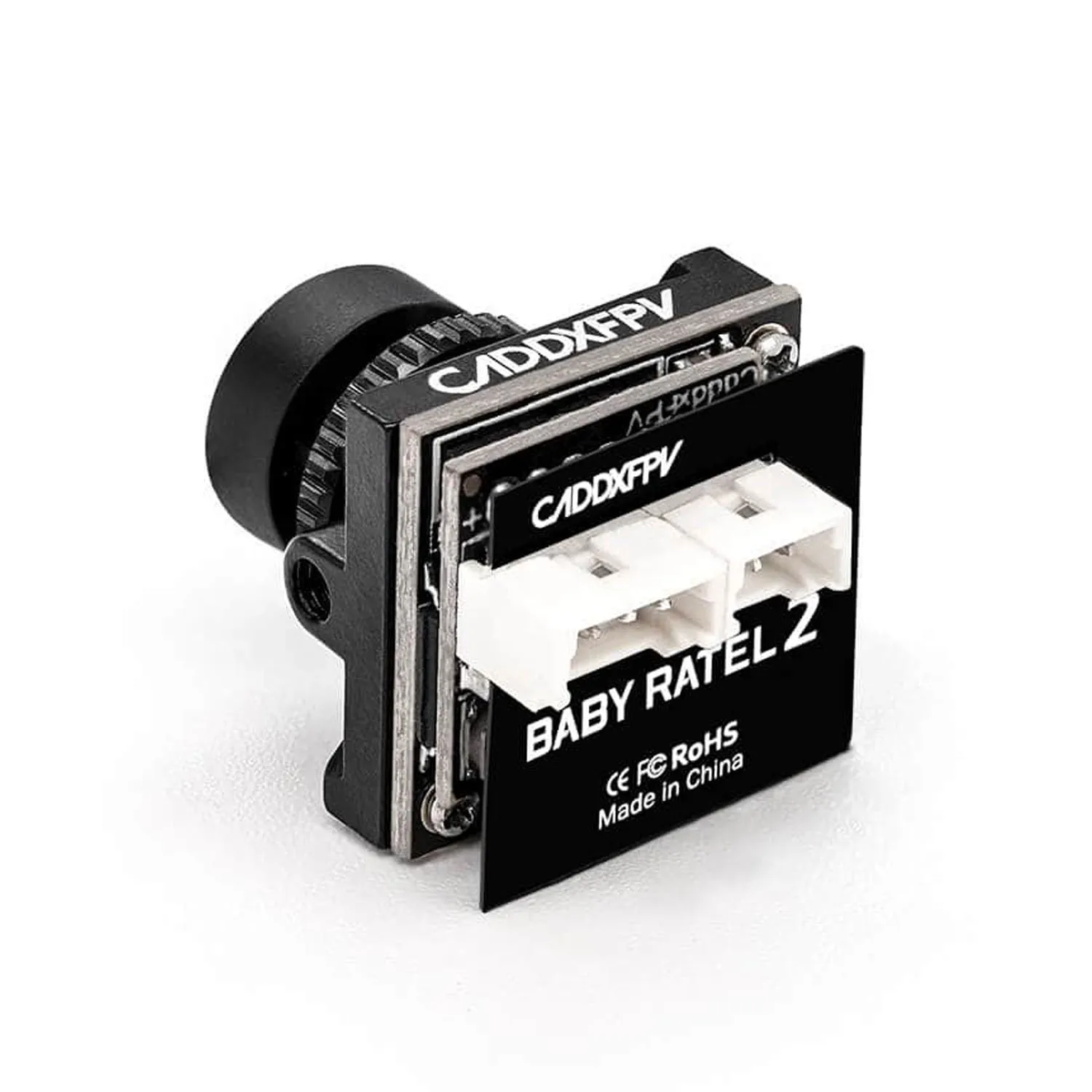 Comparaison de taille : la CADDX Baby Ratel 2 Nano à côté d'une pièce de monnaie, montrant son format compact.