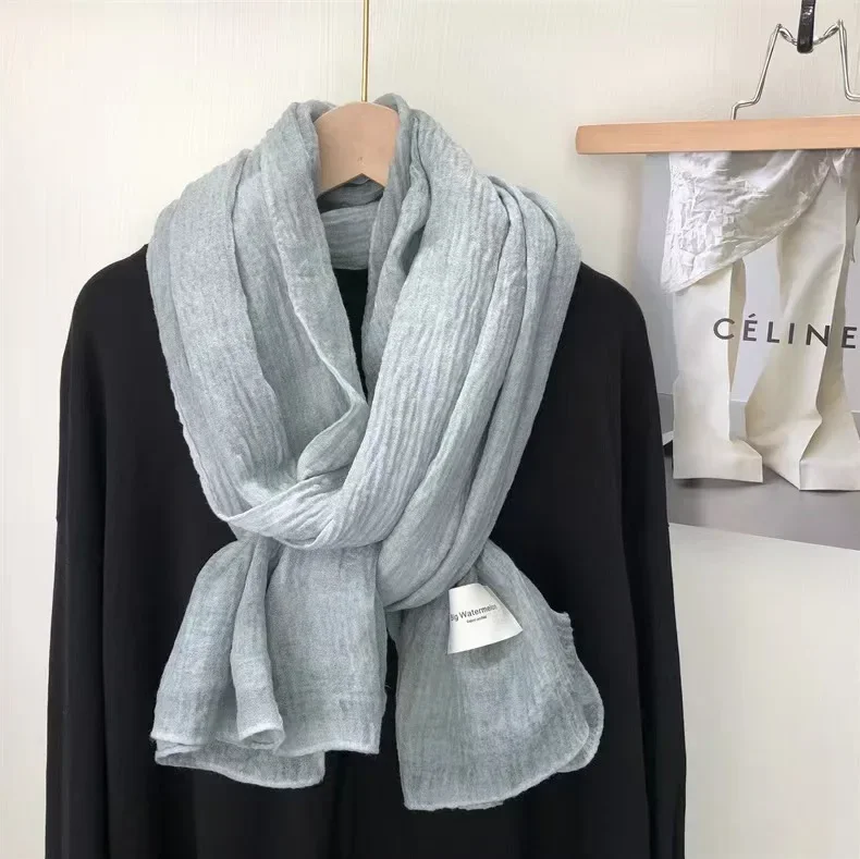 A super soft and ordinary cotton and linen scarf for women in autumn and winter, a warm, delicate, and artistic shawl in a solid color.