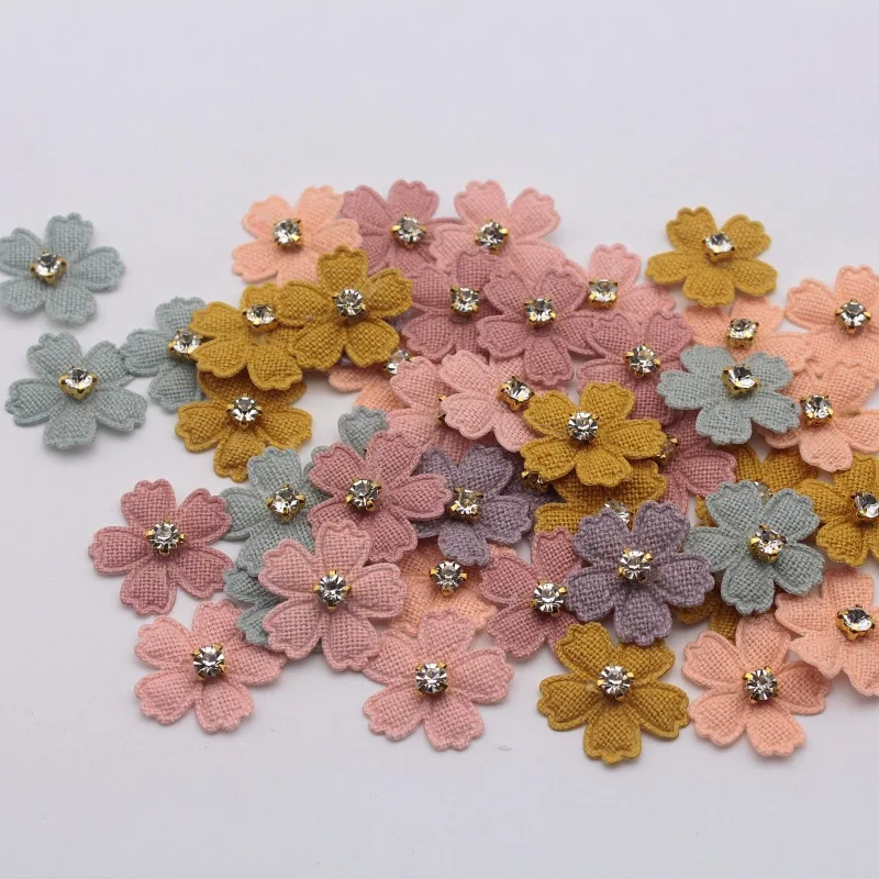 A set of 20 small fabric flower patches, perfect for use in projects, hair accessories, headbands, bows, and hat dec