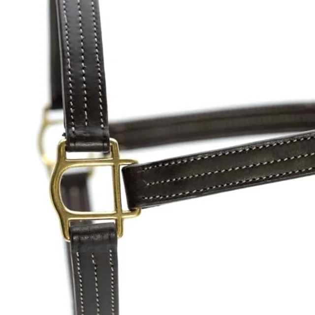 Horse turnout halter for outdoor use soft leather material black color triple-stitched durability and throat snap with adjustab