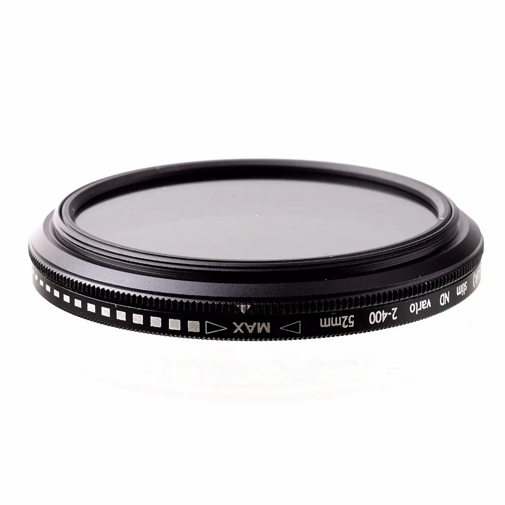 Filtre ND variable professionnel pour objectif photo, main tenant le filtre, bague tournée pour réduire la lumière.
