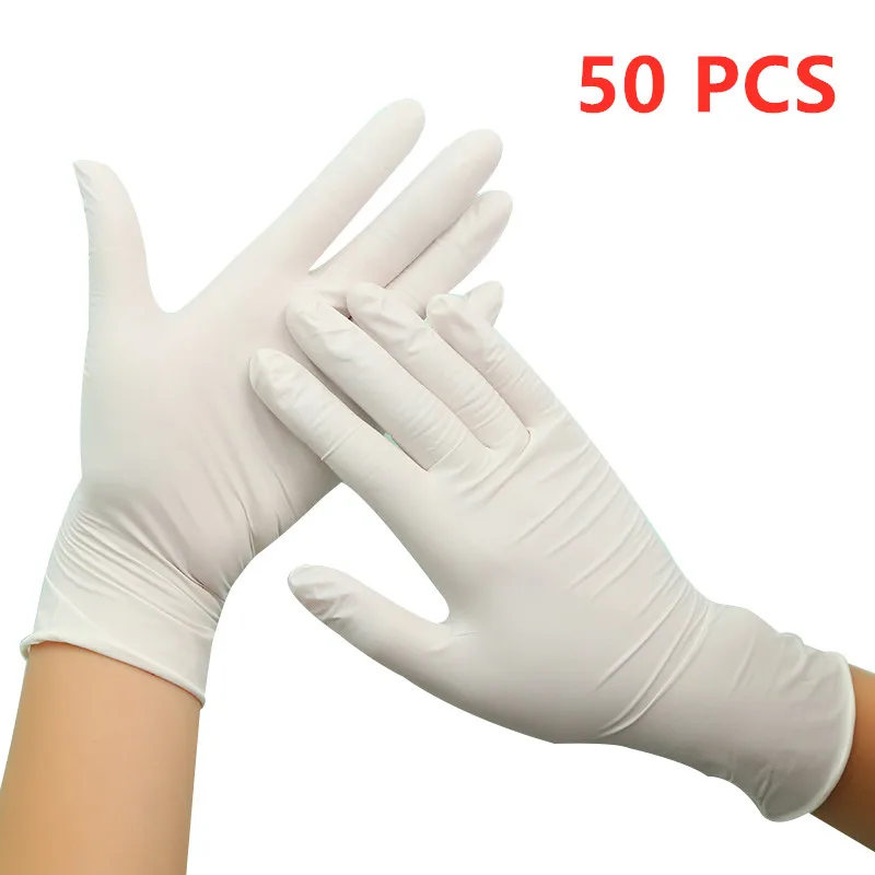 Gants nitrile jetables déballés, paire posée à plat, texture mate visible.