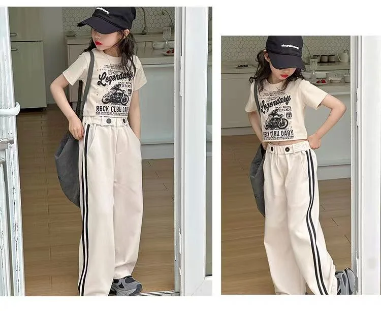 Girls’ short-sleeved T-shirt and casual pants two-piece summer set displayed on a pastel background with playful accessories beige 2