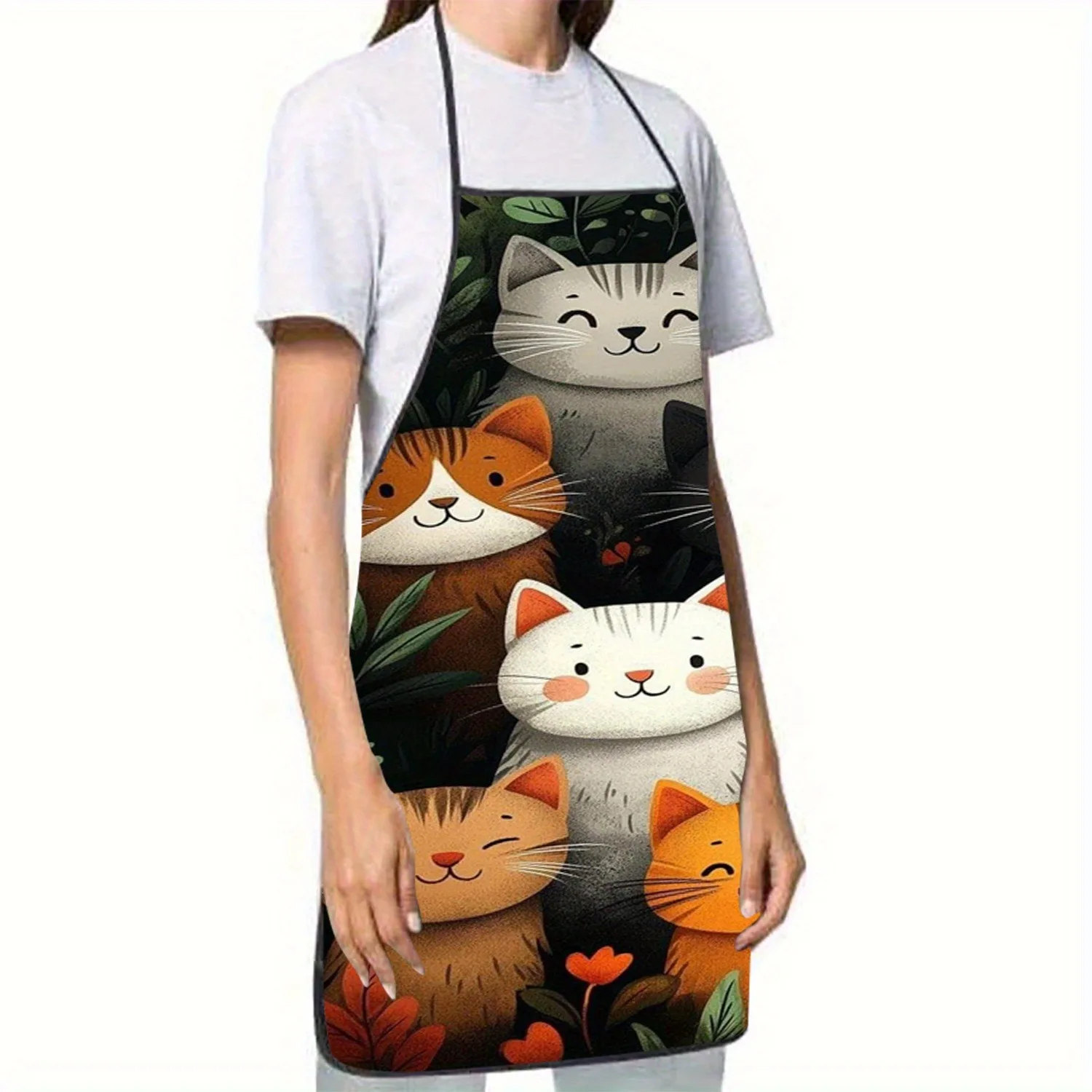 Someone wears the Vibrant Cartoon Cat Polyester Apron by KittyNook Cat Co. over a white shirt.