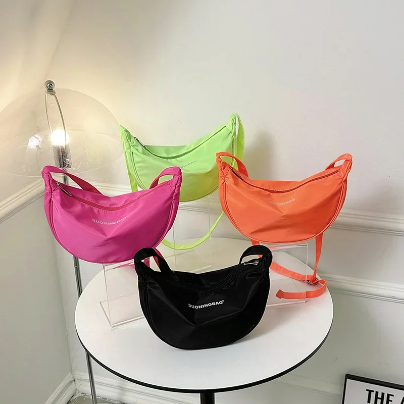 

Новинка 2024, Корейская однотонная нейлоновая сумка через плечо для отдыха для мальчиков и девочек, сумки через плечо для подмышек и Пельменей