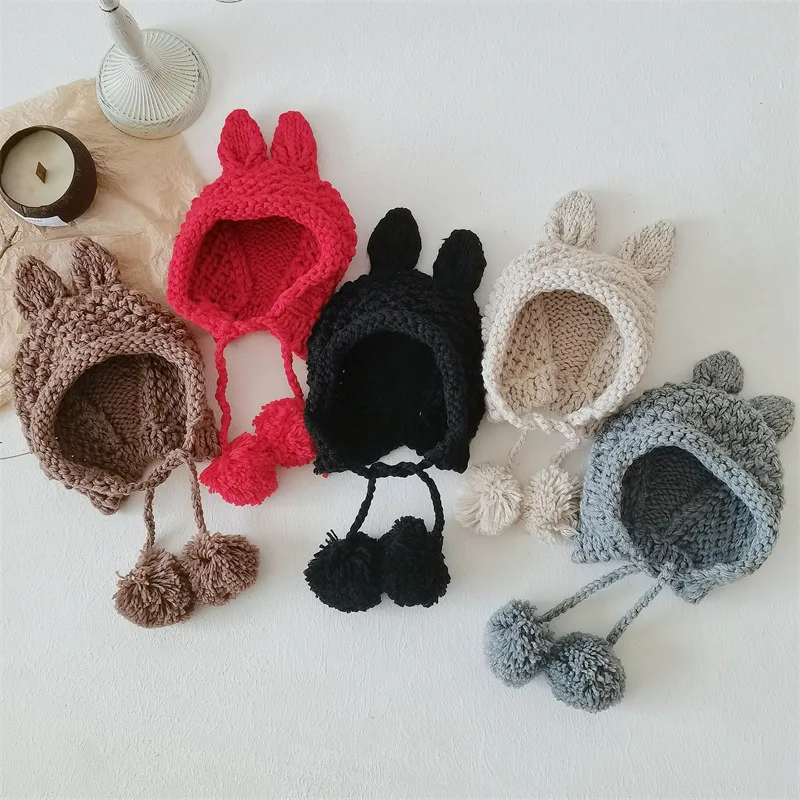 

Autumn Winter New Baby Retro Solid Beanies Lacing Pompons Beanies Girl Infant Earmuffs Warm Knitted Hat Boy Children Casual Hats