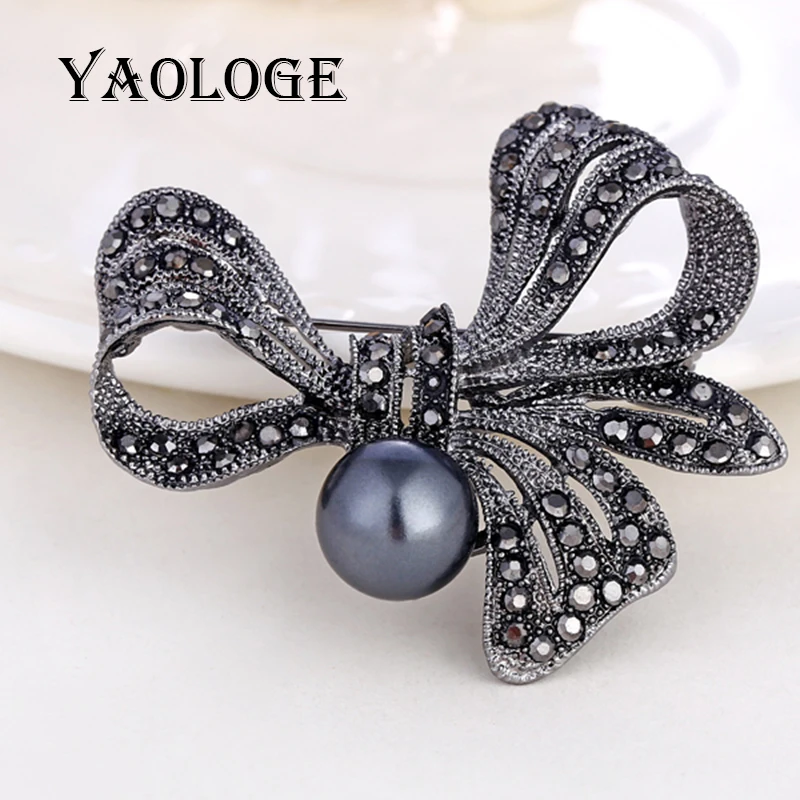 

YAOLOGE Vintage Retro Style Brooches for Women Crystal Big Pearl Decoration Bow Tie Shape Women Pins Brooch on Clothes Backpacks