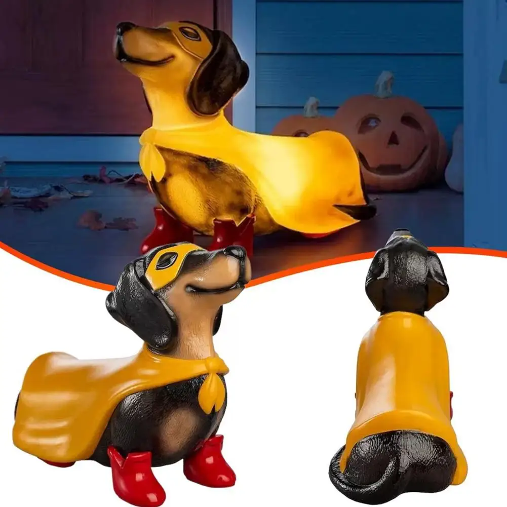 Superhero Dachshund statue wearing yellow cape and red boots for Halloween tabletop home decor