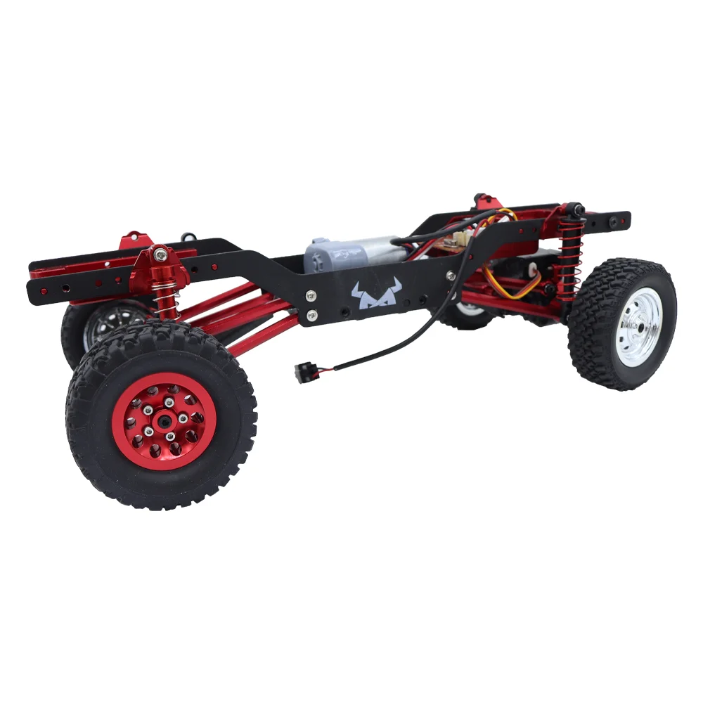 Quatre jantes et pneus pour voiture RC 1:10 alignés, prêts à être installés comme pièces de rechange.