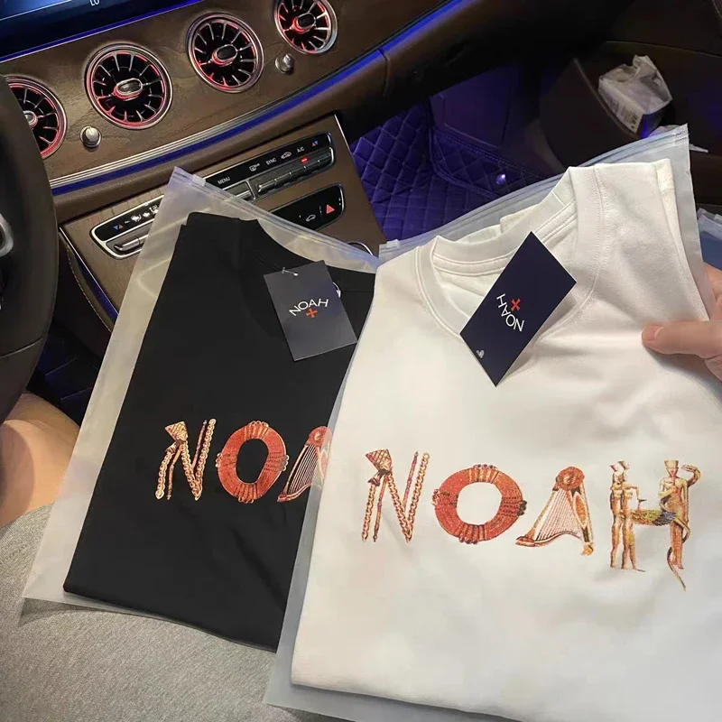 

Mesh Orange Print Portrait Logo NOAH T-Shirt Black White Men Women High Quality Oversize Casual T Shirt Embroidery Cross Tag