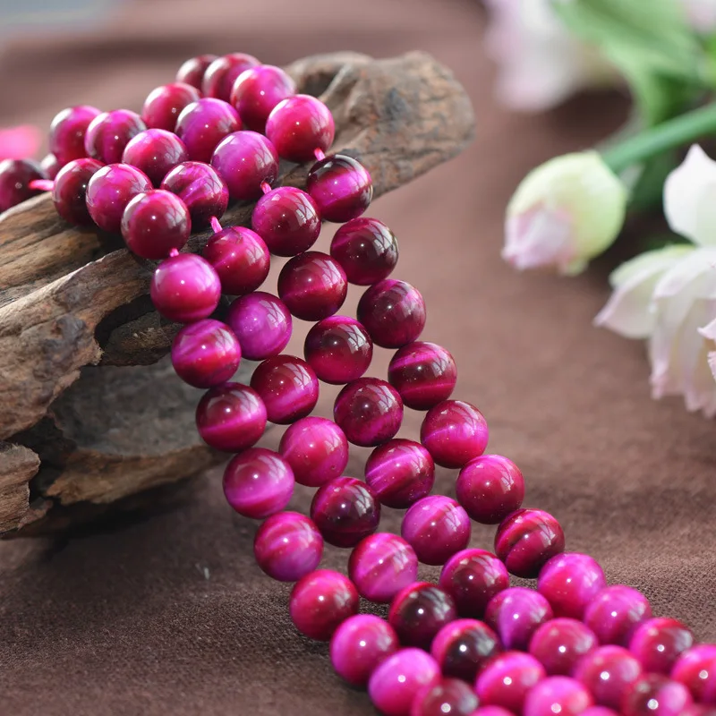 

Joanlyn Grade A Natural Rose Red Tiger's Eye Beads Enhanced Color 6mm-12mm Smooth Polished Round 15 Inch Strand TE17
