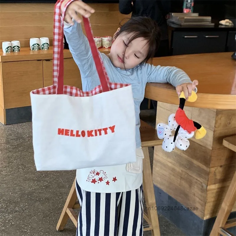 Sanrio 헬로 키티 패션 토트 백 여성의 새로운 트렌드 대용량 핸드백 하라주쿠 단순 캐주얼 통근 캔버스 숄더 백