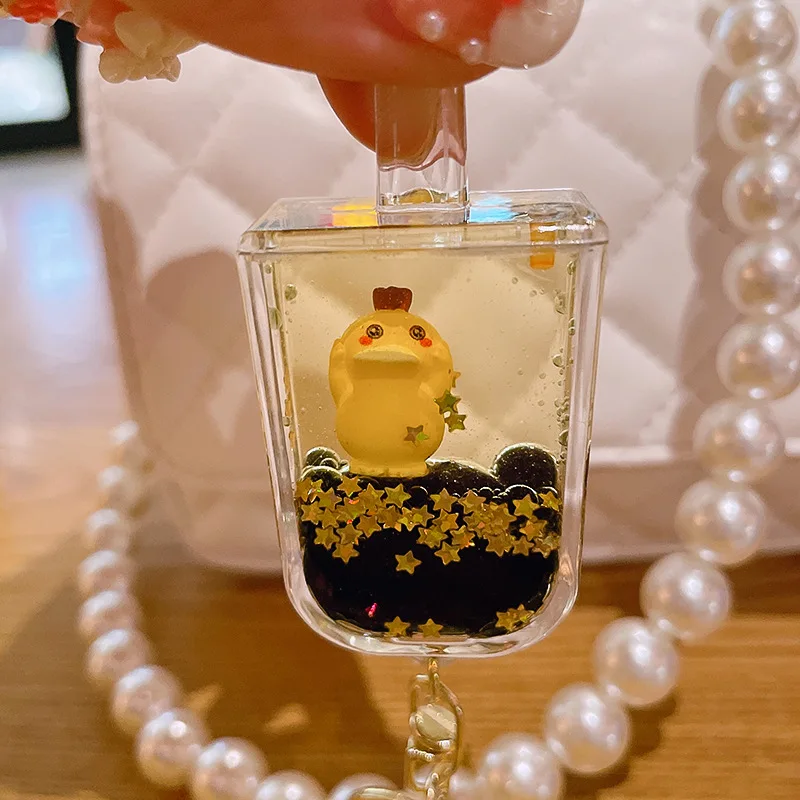 Netizens can reach duck keychains with oil floating cartoon figurine keychains, quicksand bottle pendants 4