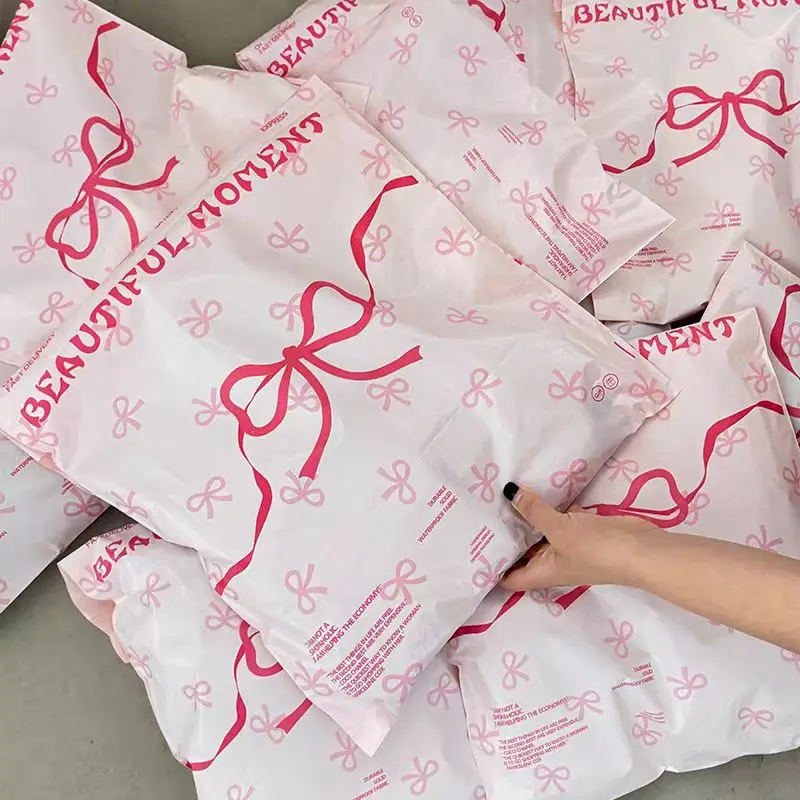 50Pcs Plastic Pink Courier Postal Bag Cute Bow Prinitng Clothes Mailer Storage Packaging Bag Gifts Shoes Express Transport Pouch,courier bag,mailing bags,packing pouches,express bag