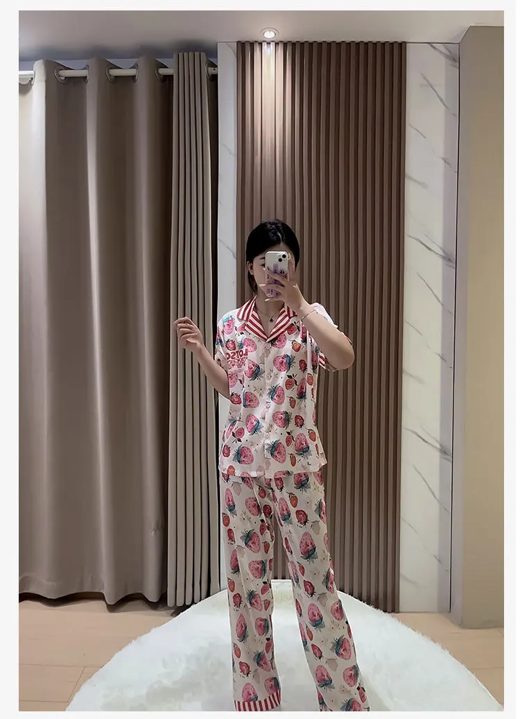 Pink Strawberry Satin Pajama Model that is wearing a Sleepy Girlz Co Pink Strawberry Satin Pajama