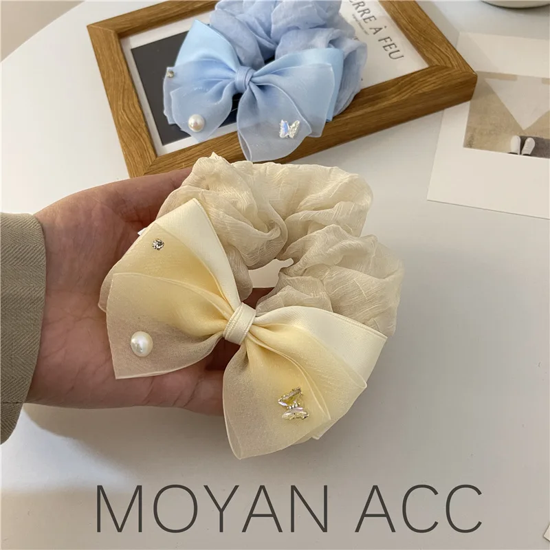 

Simple pearl butterfly rhinestone bow large intestine hair ring female high-end sense hair rubber band head rope Korean version