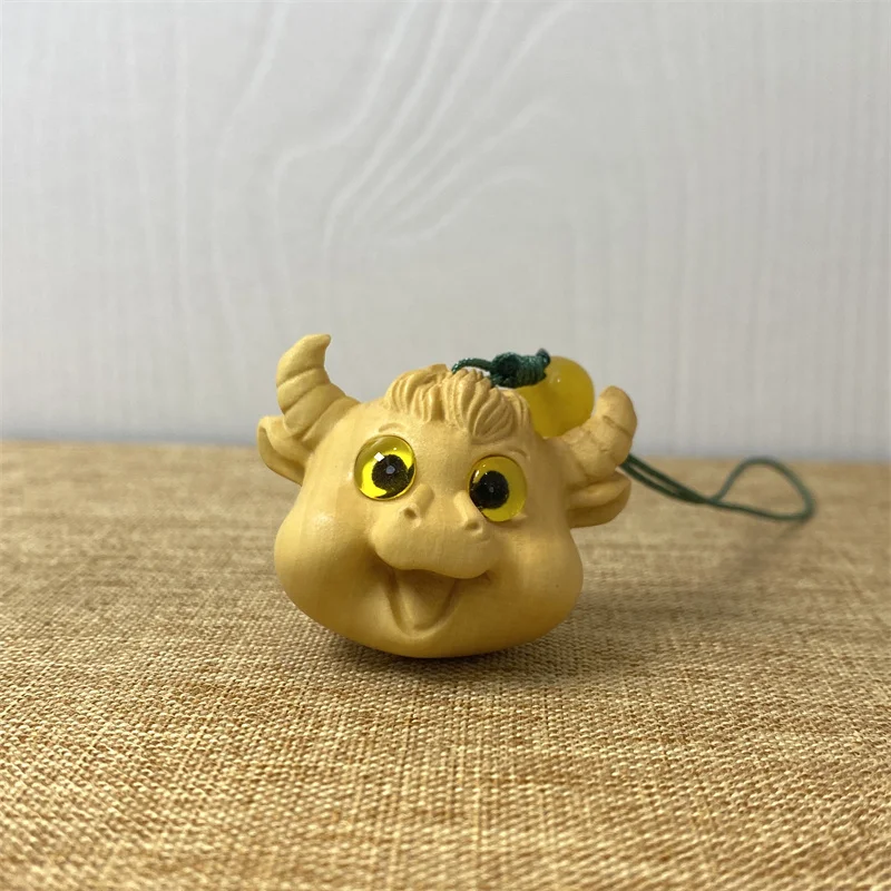 

Boxwood carving cute cow decorative chain Solid wood craft zodiac animal cow mobile phone bag key chain pendant statue