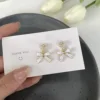 2022 New Simple Enamel White Bow Ear Clip on Earrings Female Fashion Sweet Pearl Heart Clip Earrings Without Piercing for Women 3