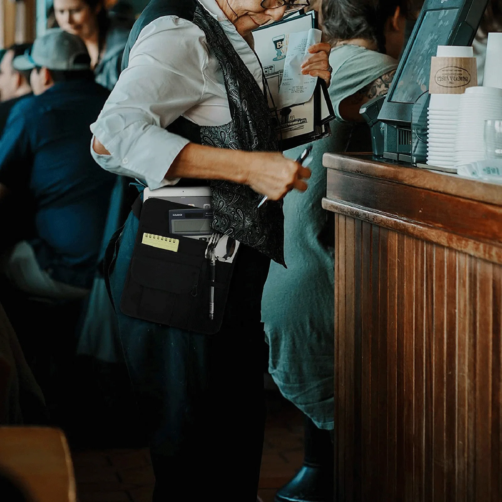 Riñonera para camarera, delantales con bolsillos y cinturón ajustable,  ideal para servidores y camareros en entornos de restaurantes ocupados,  Negro