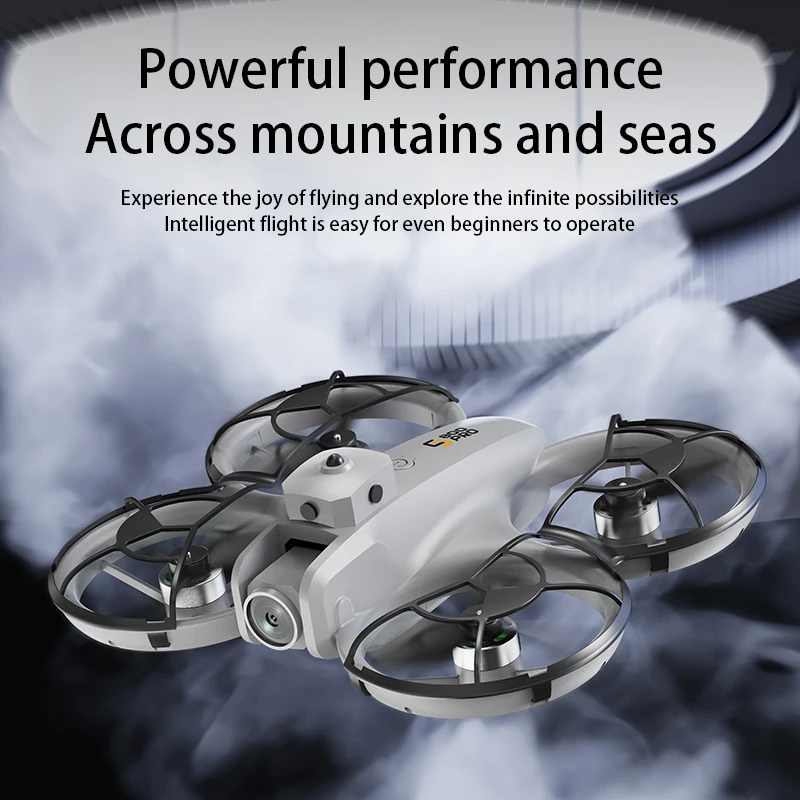 Drone jouet pour enfant avec caméra et système d'évitement d'obstacles posé sur une table avec trois batteries de rechange
