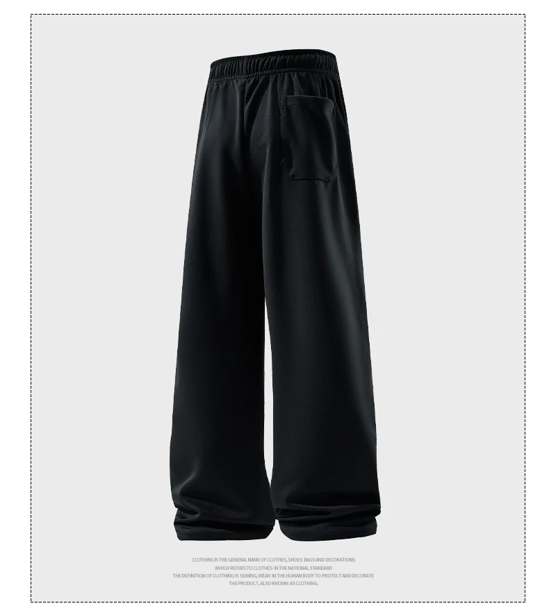 Man wearing loose wide-leg sweatpants with drawstring waist in a casual autumn streetwear setting black 02