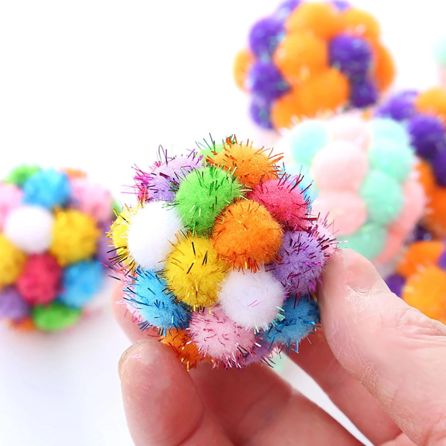 Enhance your crafting supplies with these vibrant, high-quality Pom Poms. The soft textures and playful colors will add a fun an